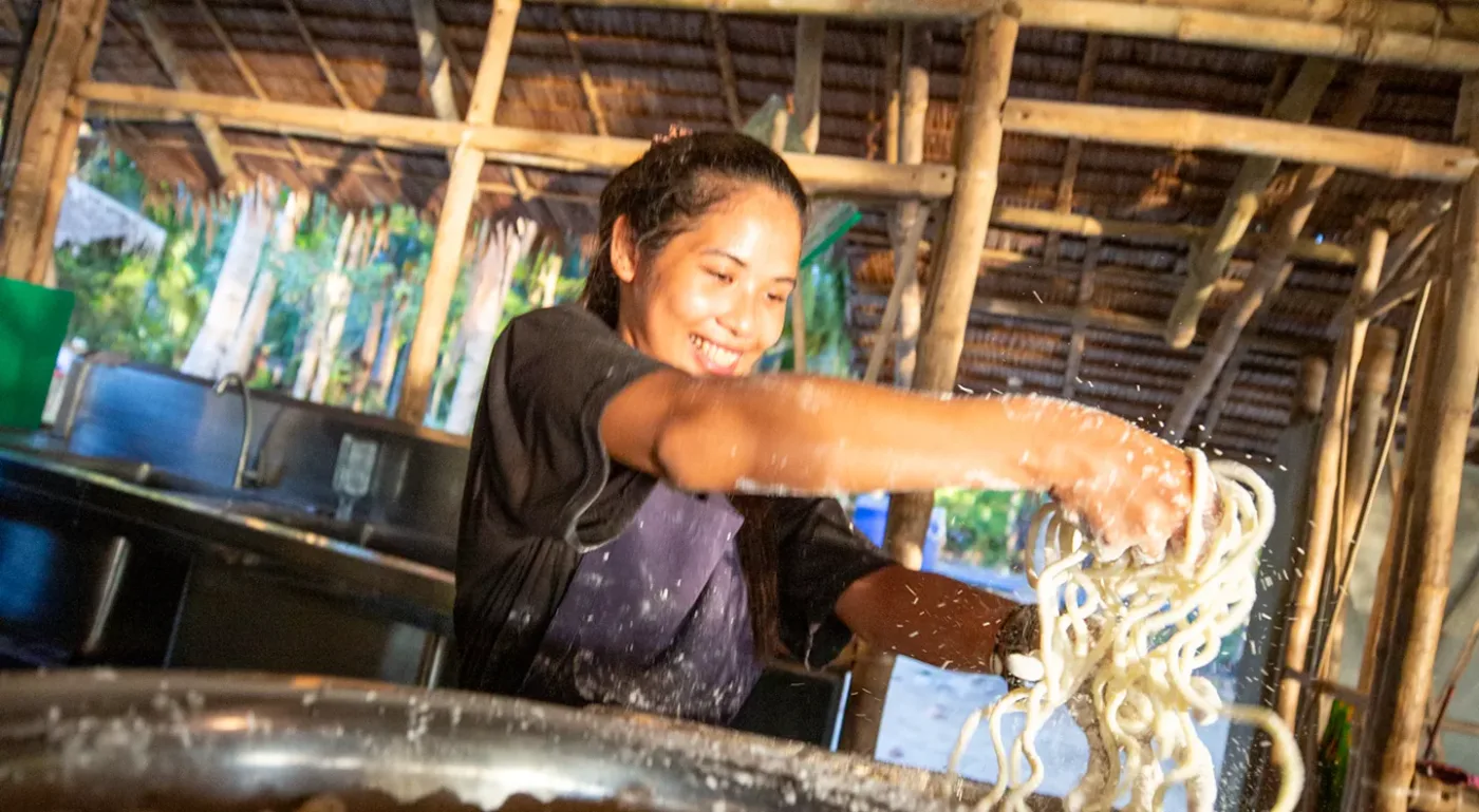 Hand-pulled noodles being prepared at Camp Ngey Ngey