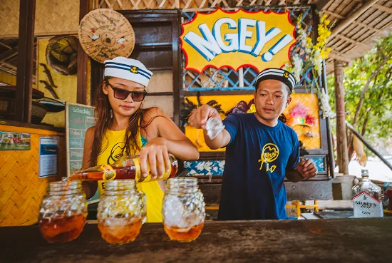 Tao hosts preparing drinks at Camp Ngey Ngey